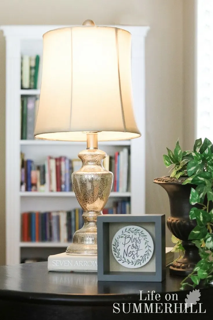 Stacking books, using an old lamp, painting a vase for decorations to save money