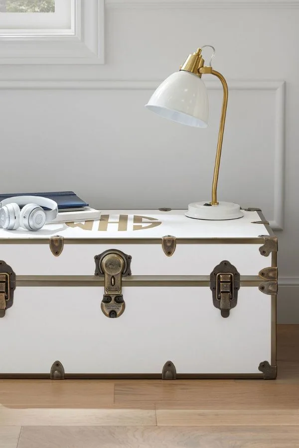 Neutral color scheme college dorm room idea.  Inspiration photo from Pottery Barn of a white trunk