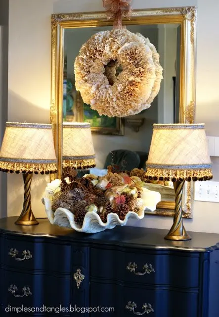 fall wreath ideas coffee filters and hung on a mirror inside a home.  This beautiful wreath is made my Dimples and Tangles