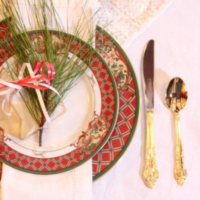 Traditional Christmas Table Setting with Jewel-Tone Layers and Classic Holiday Charm