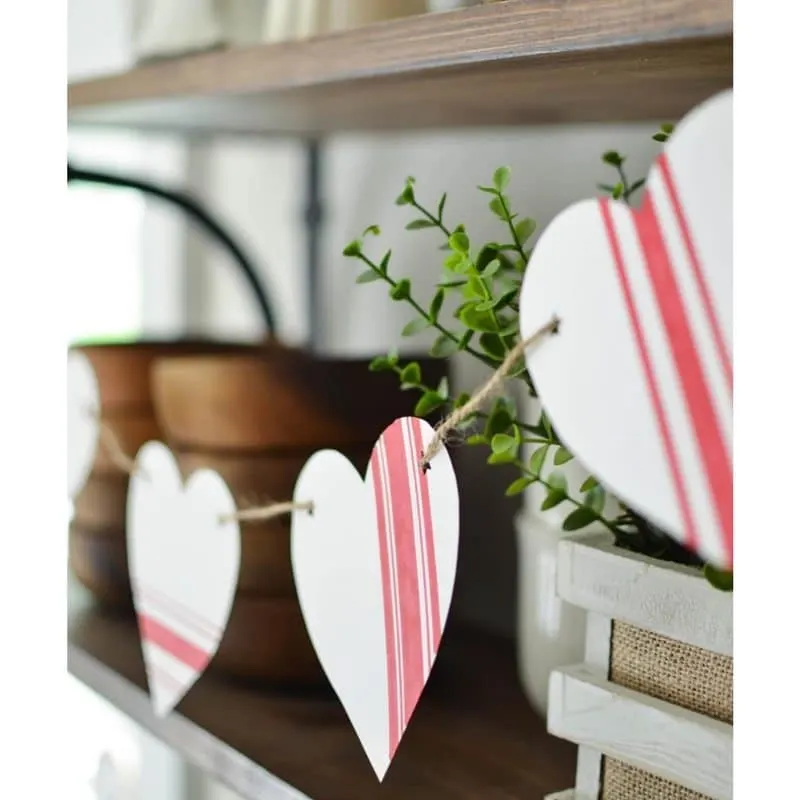 Farmhouse Valentine banner ideas of paper hearts with grain sack red and white stripes by Slightly Coasta