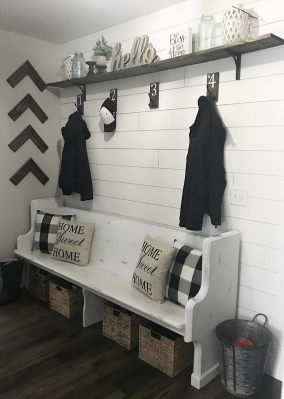 Mudroom with shiplap wall, coat rack shelf and wooden bench
