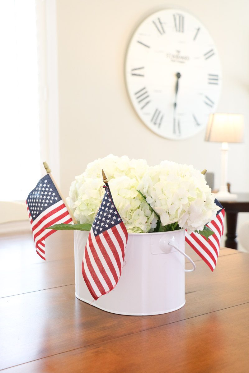 4th of July centerpiece with stick flags and hydrangeas