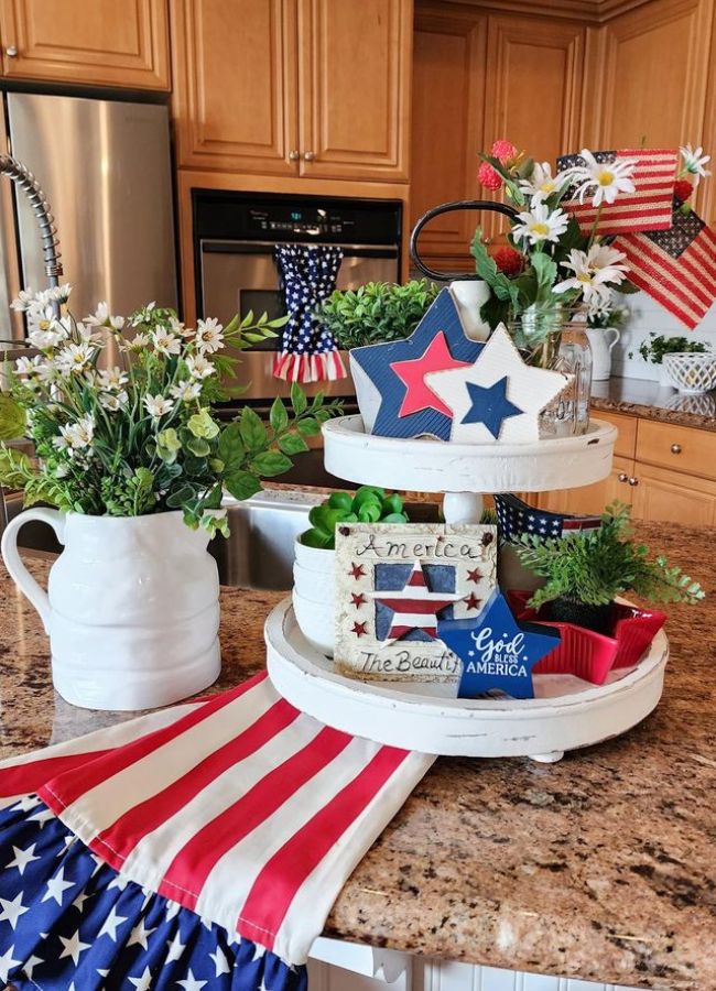 Patriotic themed tiered tray with red, white and blue colors, stars, flags and more.
