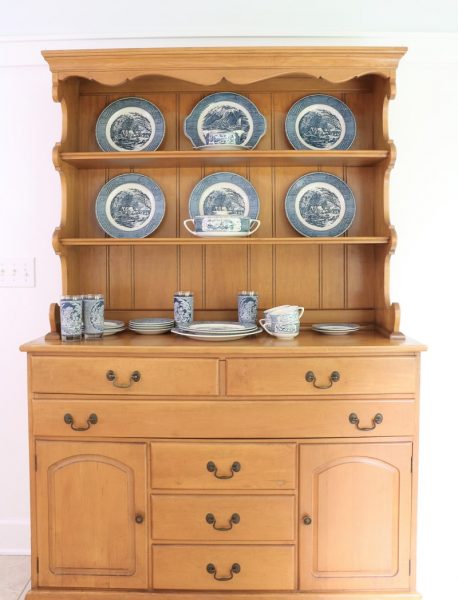 Storing and Displaying Vintage Dishes in a Farmhouse Hutch