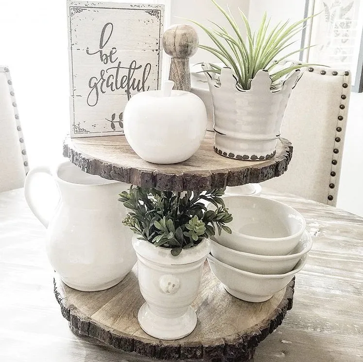 Fall Decor rusted wood tiered tray by A Simply Styled Nest. A unique tray with two tiers. Each level is a beautiful cut of wood topped with all white accessories. A lovely soft white sign "be grateful", which apple and a few plants and dishes.