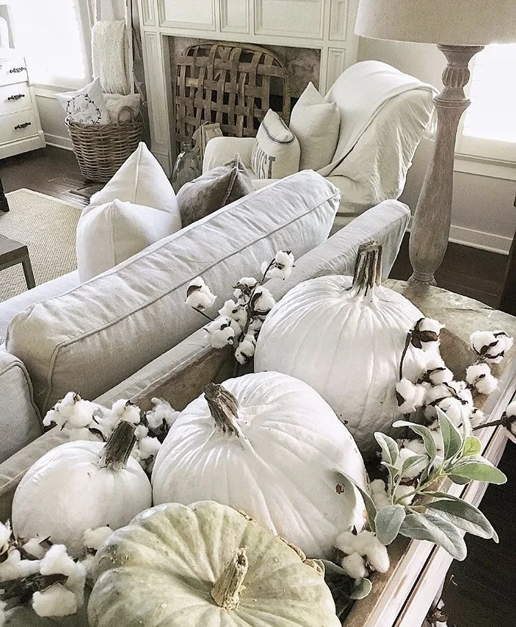Decorating with dough bowls placed on sofa table and filled with pumpkins and cotton by She Gave It A Go