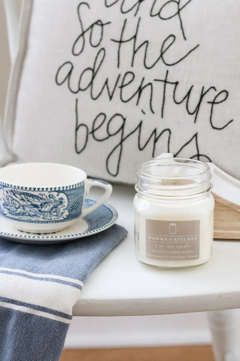How to paint with milk paint tutorial. Photo styled with Antique Candle Works candle, and so the adventure begins pillow, currier and ives cup and saucer and blue and white stripe dish towel