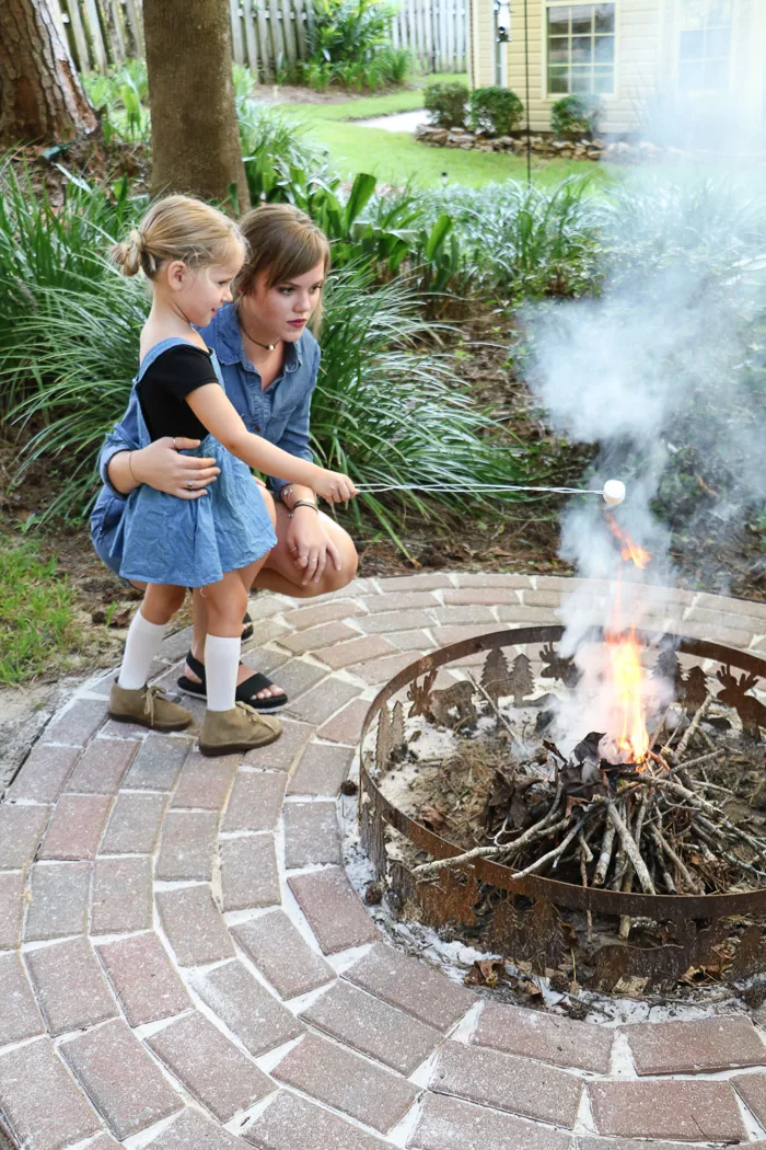 Outdoor fall decor roasting a marshmallow