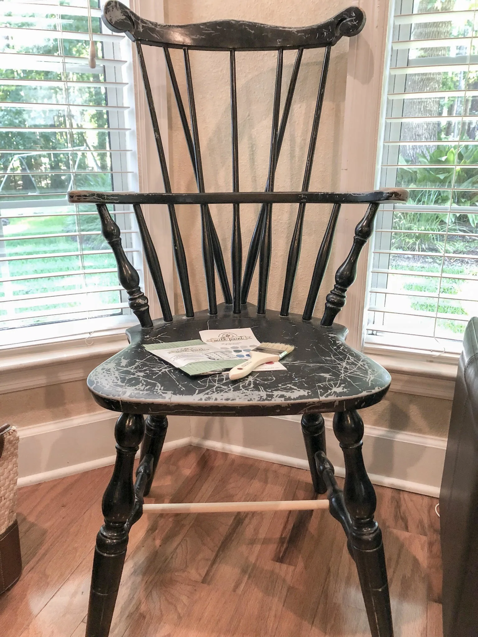 Black windsor chair that was repaired and ready to be painted with Miss Mustard Seed Paint.