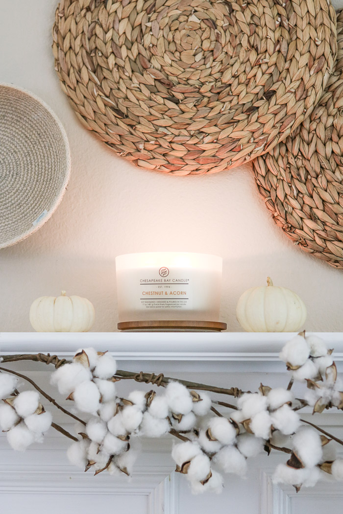 How to hang baskets on a wall for a DIY fall decor mantel design using candles and pumpkins