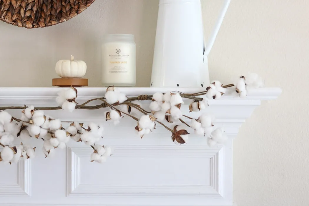 DIY fall decor mantel with baskets, candles, pumpkins, cotton garland and french vintage pitcher