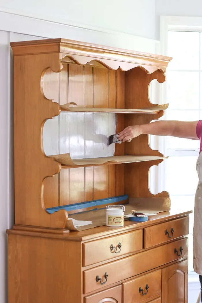 How to paint with chalk paint. Apply the first coat of paint on a hutch furniture piece.