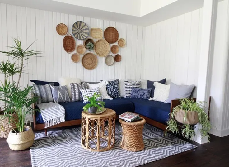 How to hang baskets on a wall by Deeply Southern Home over a daybed sofa