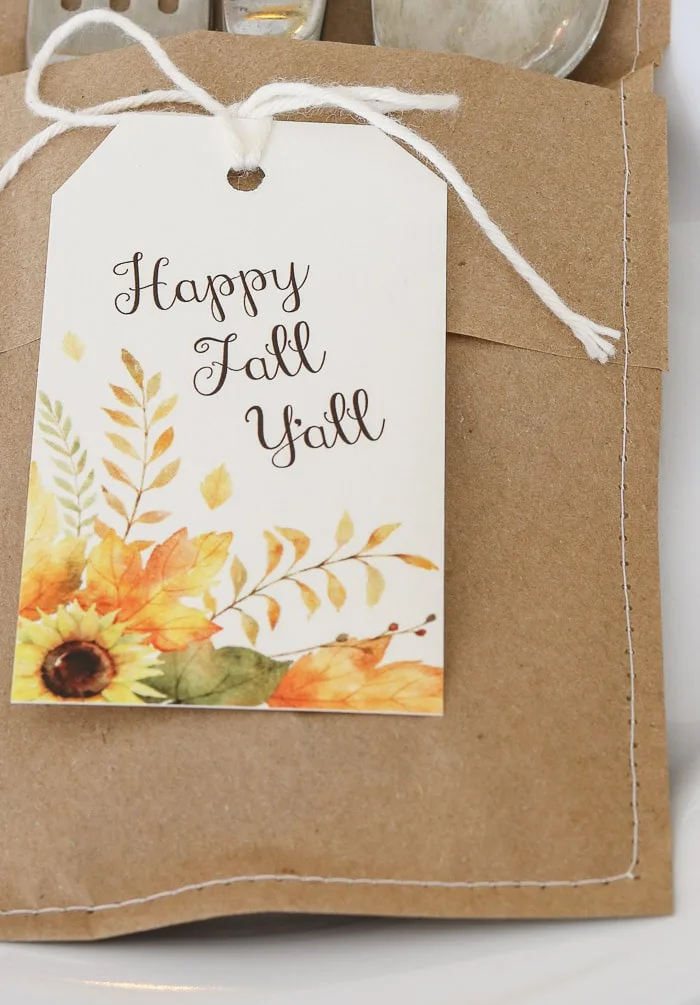 Sew along edges of folded craft paper for Thanksgiving table decorations DIY
