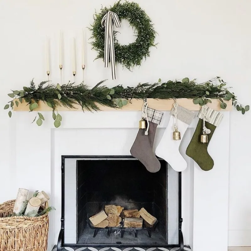 Minimalist Christmas Decorations by House Seven Design mantle decor with stockings and wreath