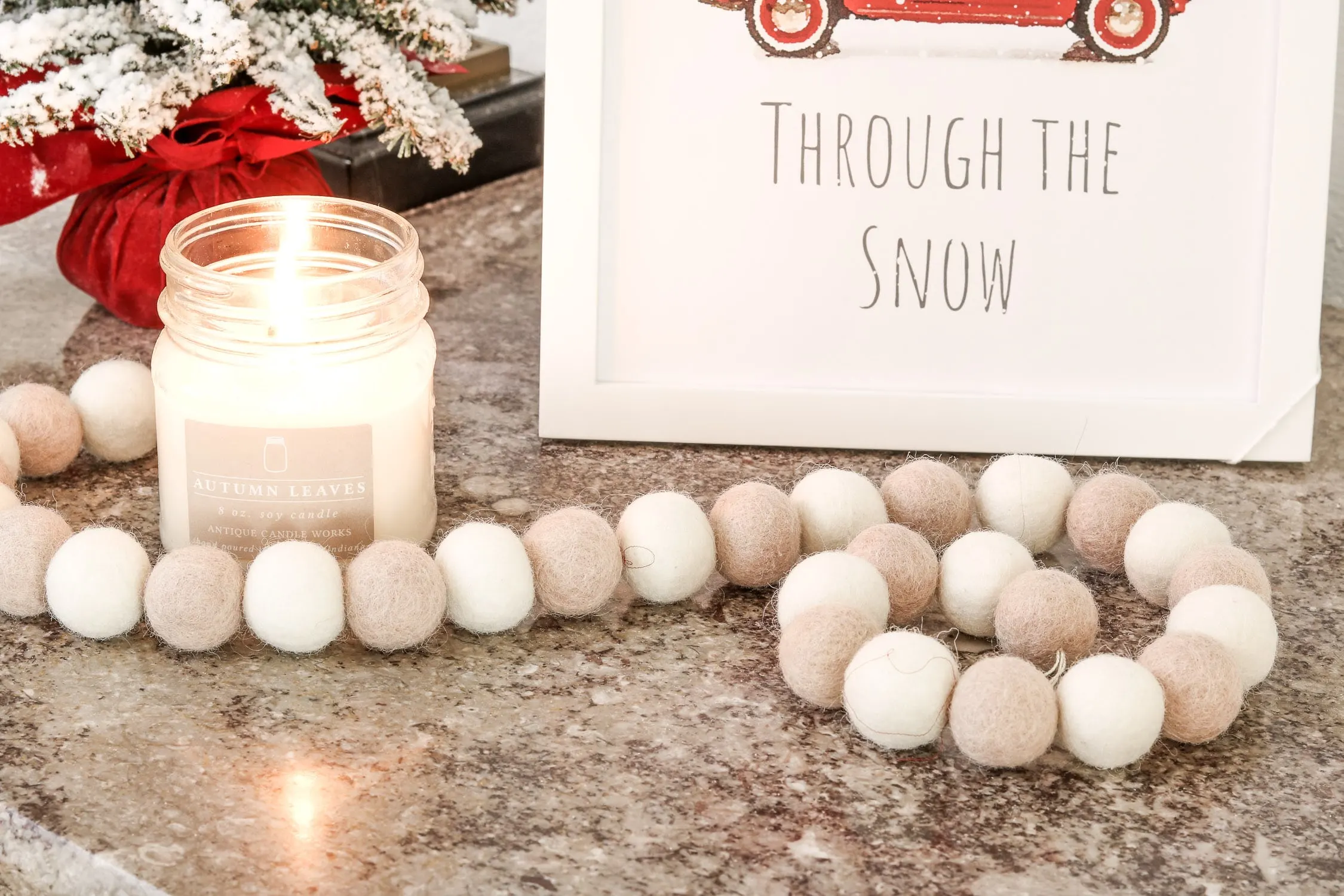 Christmas printable decor displayed with Antique Candle works candle and felt beads