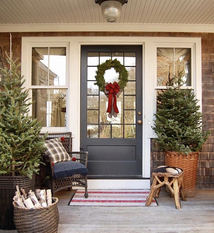 Christmas decorating ideas for porches by Old Silver Shed with trees and a wreath and birch wood