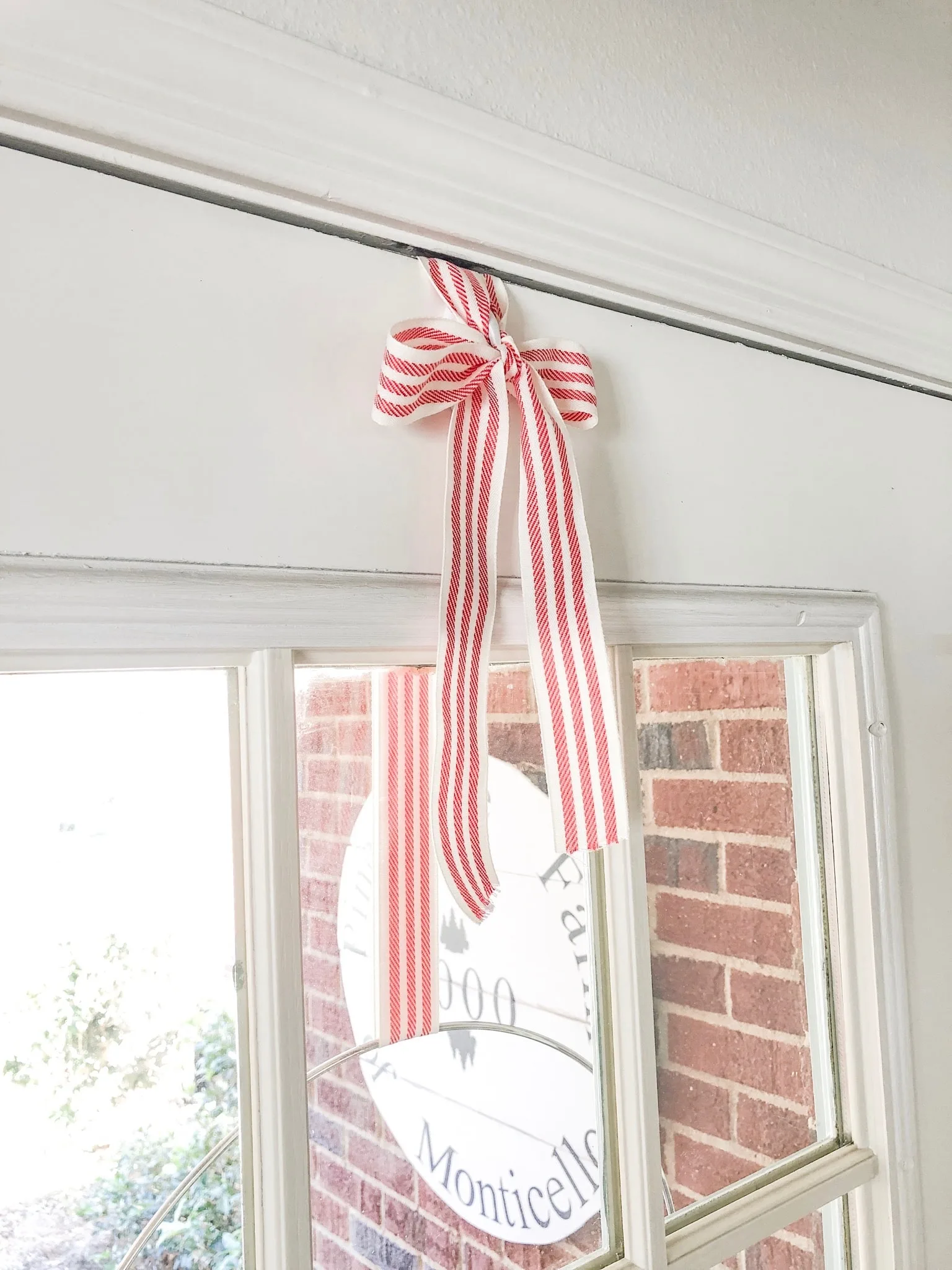 Christmas decorating ideas for front porches and how to hang a wreath with ribbon