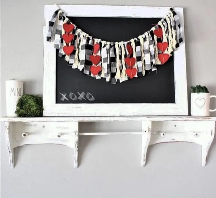 Valentine's Day Garland by Holly Bee & Company with a chalkboard adorned with fabric strip garland