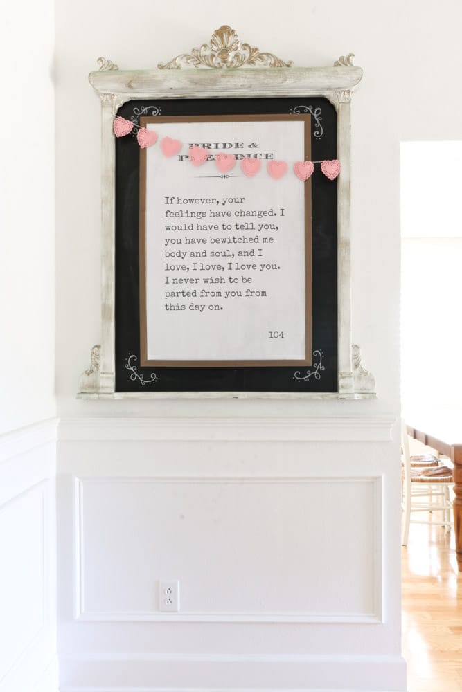Valentine's day printable poster book page framed on chalk board with pink heart doily garland