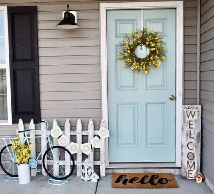 Front Porch Decorating Ideas by Shiplap Shanty with an aqua bicycle and yellow wreath