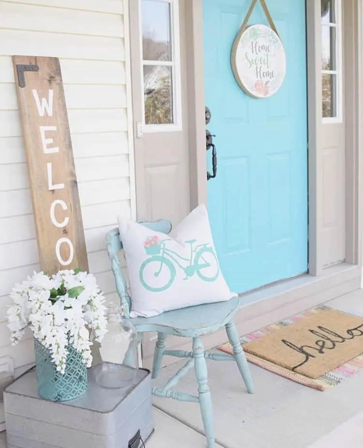 Front Porch Decorating Ideas by Featherbrained Fancy with white whisteria and a bicycle pillow