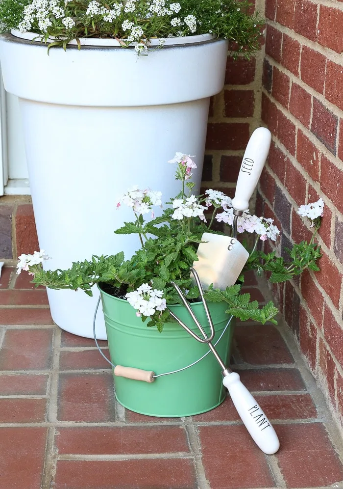spring porch decorating ideas with plants, flower, Rae Dunn and pots
