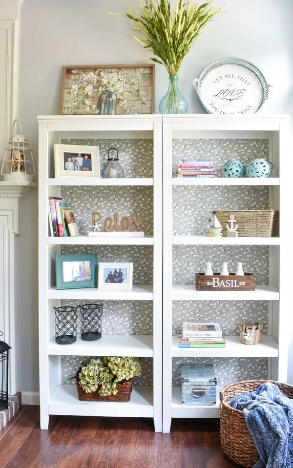 DIY Bookshelf Makeover by Heart Filled Spaces with a fabric backing bookshelf makeover