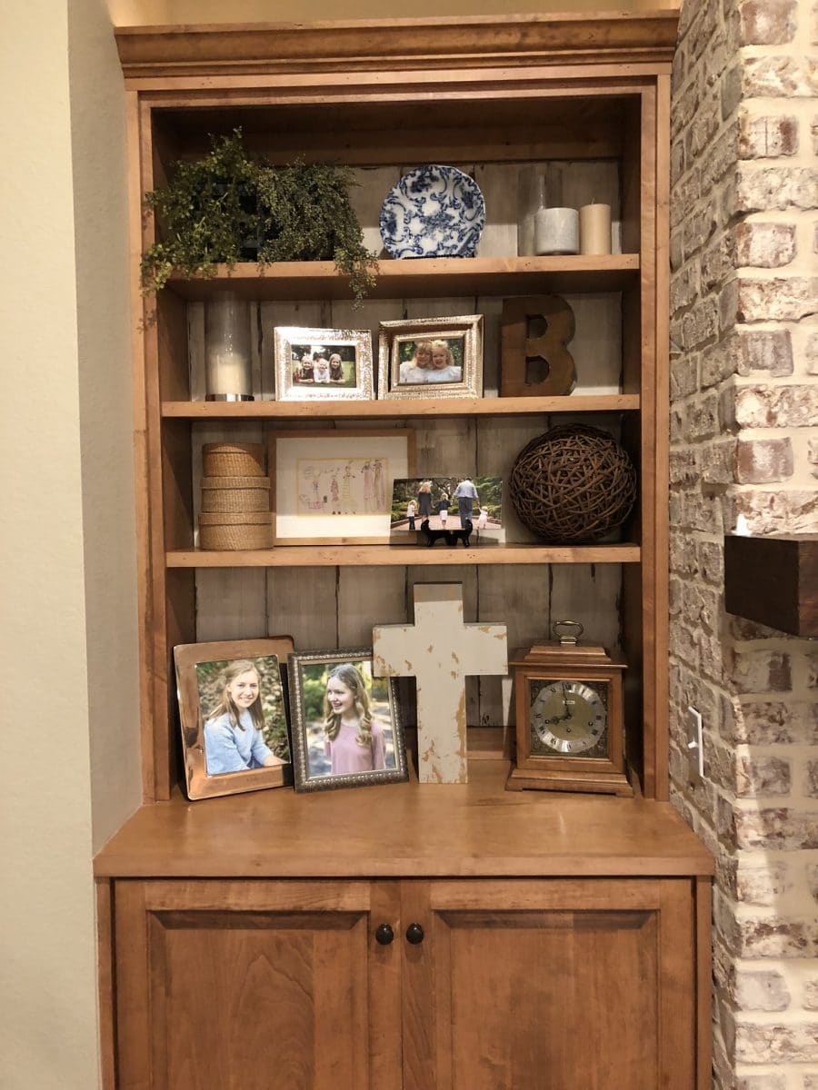 Cheap bookcase makeover showing cabinets with accessories