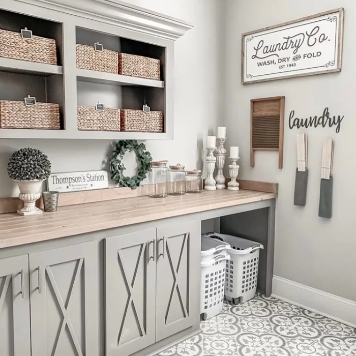 Farmhouse Laundry Room Decor by Jamie O'Dazier with large clothes pins and hyacinth baskets