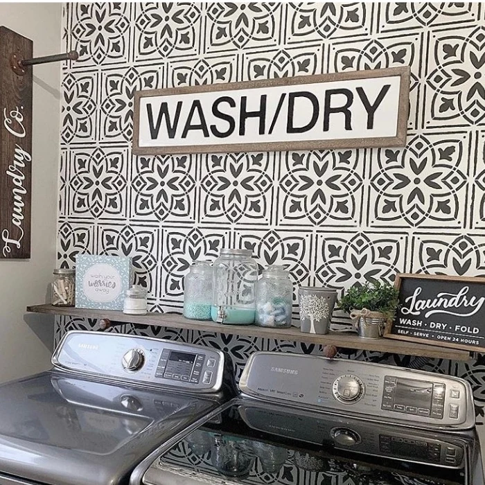 Farmhouse Laundry Room Decor by Bold Boundless Blonde with tiled walls and organized shelves