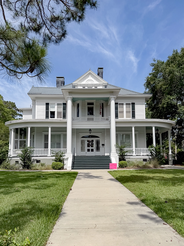 White Colonial Revivial house historic home with haint blue painted ceilng.