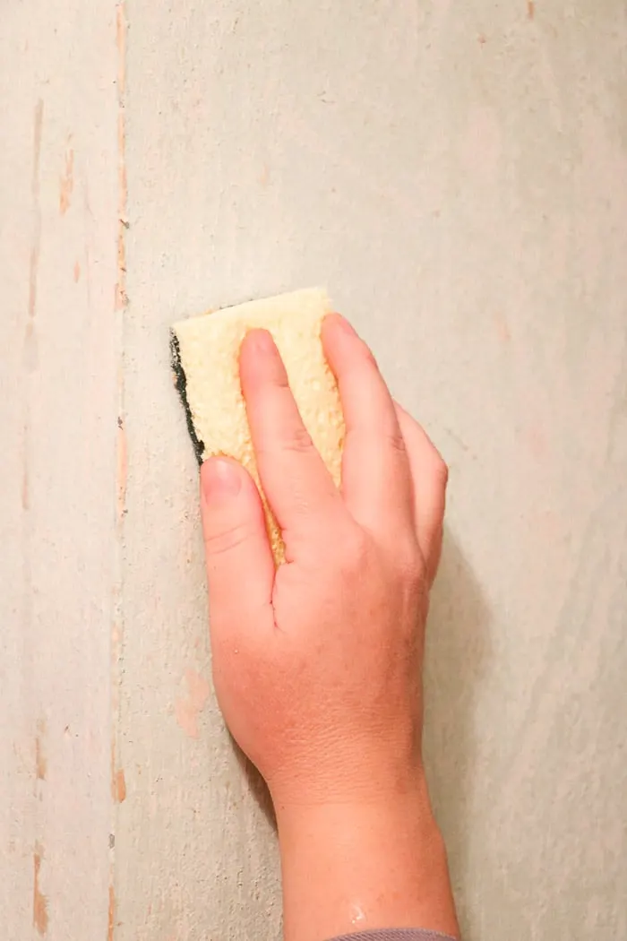 how to remove wallpaper with a steamer.  Removing old wallpaper with a Homeright steamer in a small hallway and scrubbing any residue from the wall with a scrub sponge.