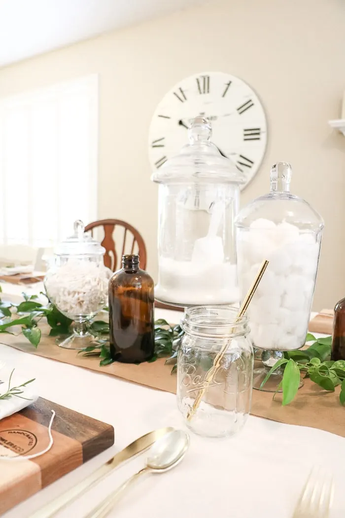 Nurses graduation party ideas that are casual and elegant.  A DIY sharing easy tips and trick for creating a vintage style medicinal apothecary centerpiece on a dining table.