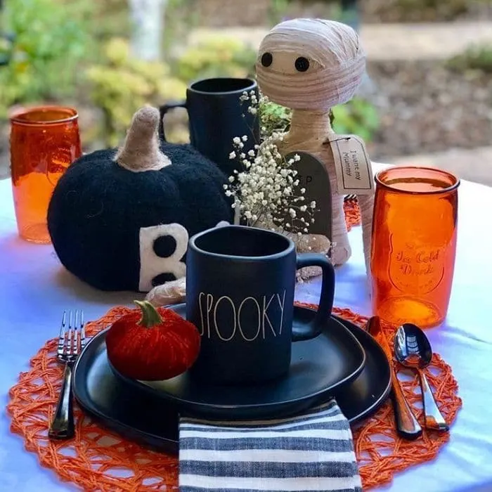 Halloween Table Decorations by 13 Tables with Rae Dunn Spooky mugs, pumpkins, mummies and more black and orange pieces