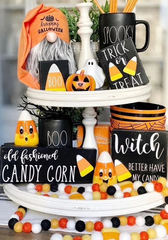 Halloween tiered tray ideas for home.  Candy corn decorations, witches sign, Boo Rae Dunn mug and more.