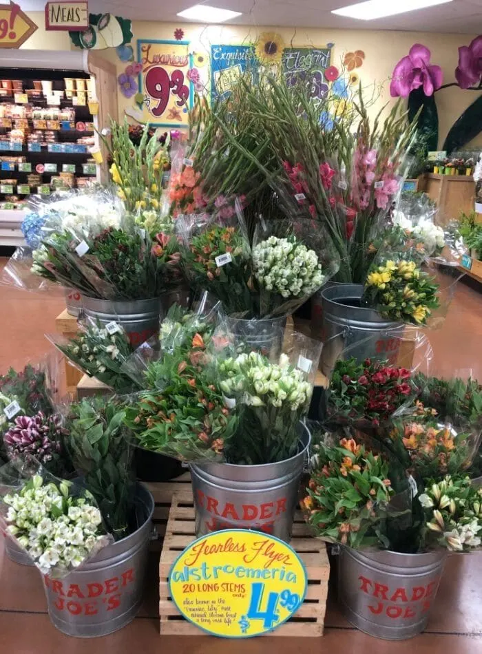 Best places to buy flowers showing the display of flowers at Trader Joes.  