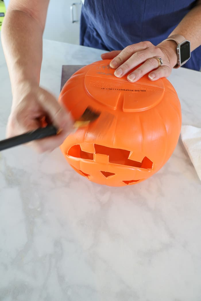 Harry Potter table decorations using a plastic jack o lantern for floating pumpkins over the table.  Use a glaze and brush on a shadow on the bottom.  