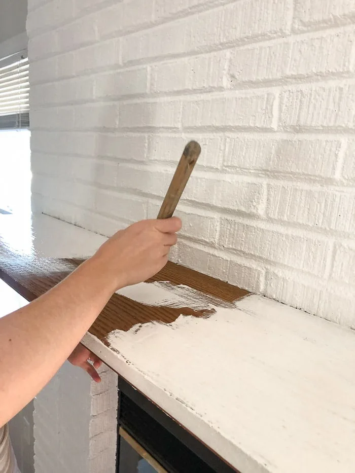 How to paint fireplace bricks.  Paint the mantle with the same primer paint combo like the Behr Marquee paint.