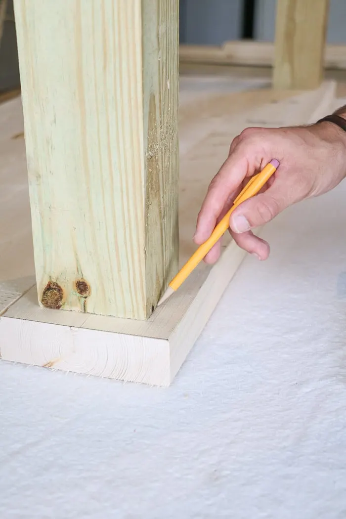 How to build a farmhouse table. Draw a line around the legs.