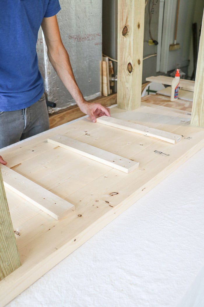 How to build a farmhouse table. Add wood braces under the top.