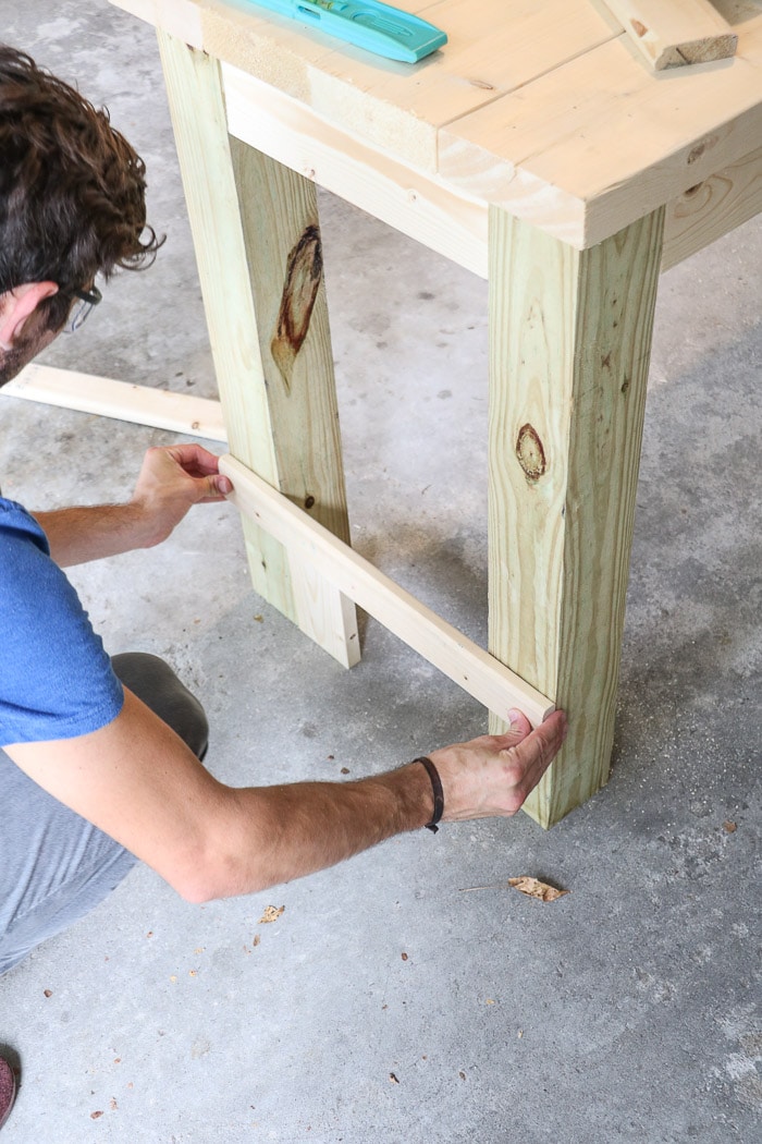 How to build a farmhouse table. Cut and attached braces for legs.