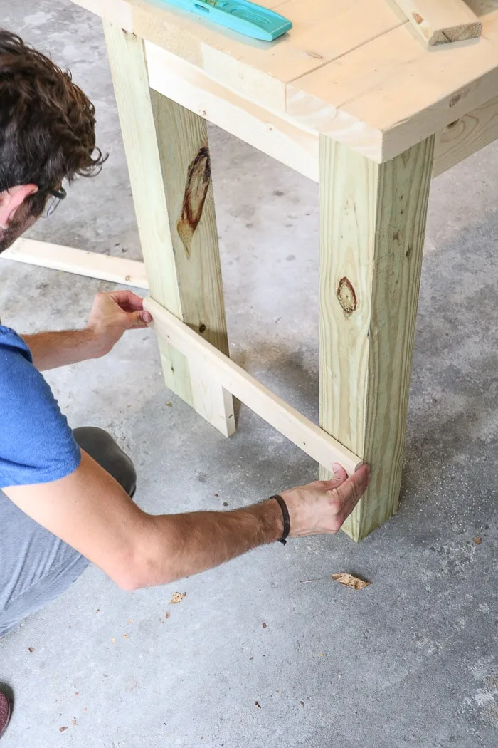 How to build a farmhouse table. Cut and attached braces for legs.
