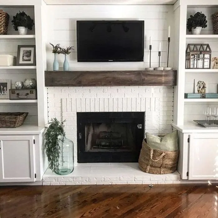 Fireplace Makeovers by Blooming DIYER with a white painted fireplace