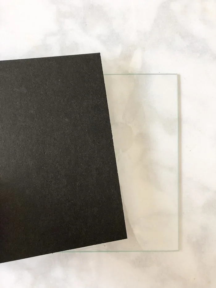 Wedding invitation keepsake idea using a minimalist black frame.