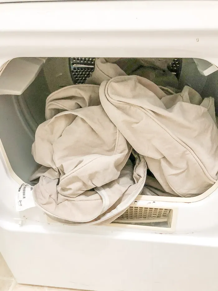 How to wash Ikea slipcover. Toss the slipcover in the dryer on medium for 15 minutes.