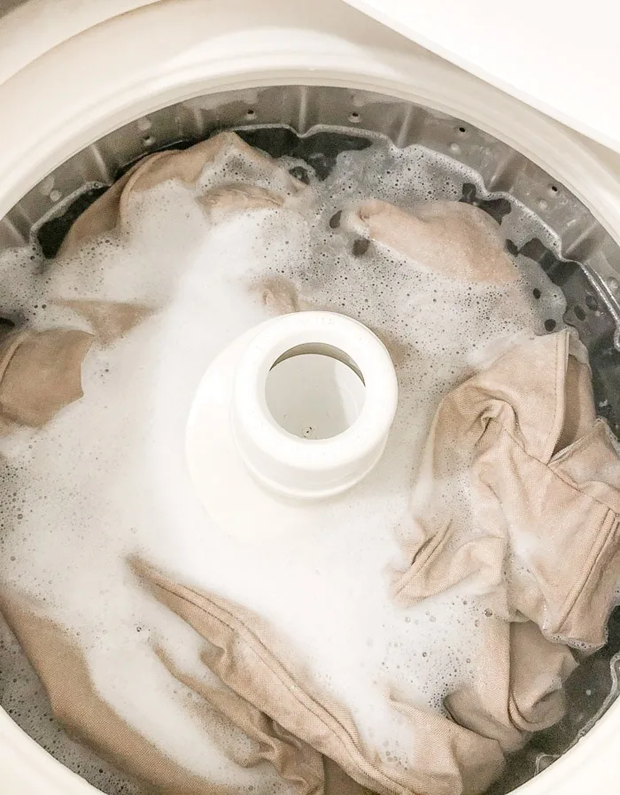 How to wash Ikea slipcover. Start wash on warm and add oxi clean and detergent.