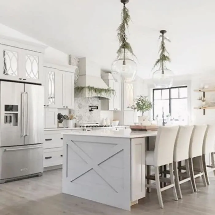 Christmas Kitchen Decor by Farm Fresh Curls with greenery hanging in the kitchen