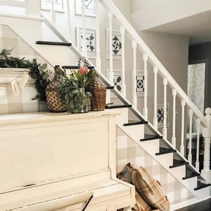 Decorating With Barn Quilts by Our Simple Hectic Home with barn quilts hanging up a staircase